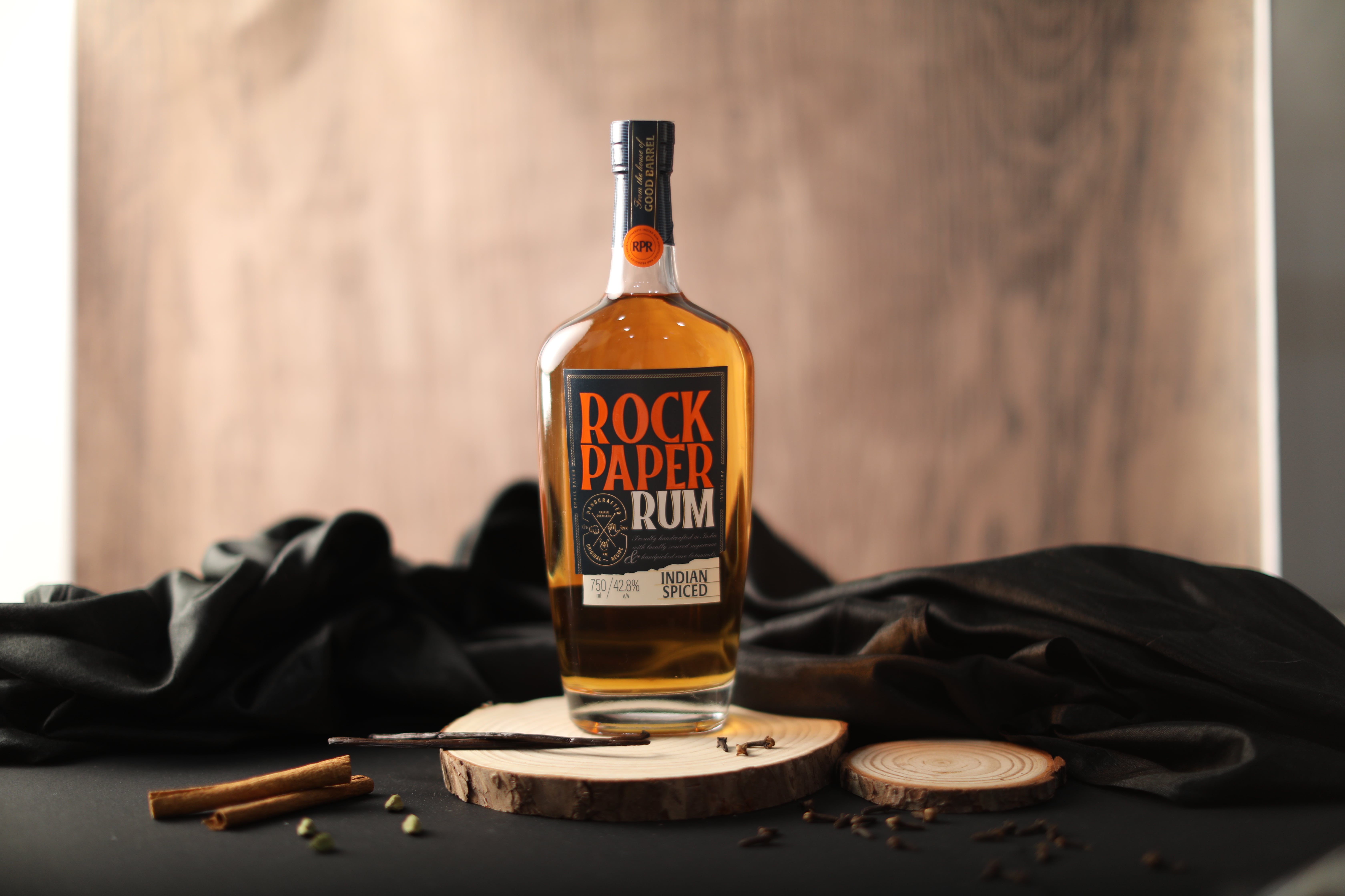 Rock Paper Rum Indian Spiced on wooden board with cinnamon and spices